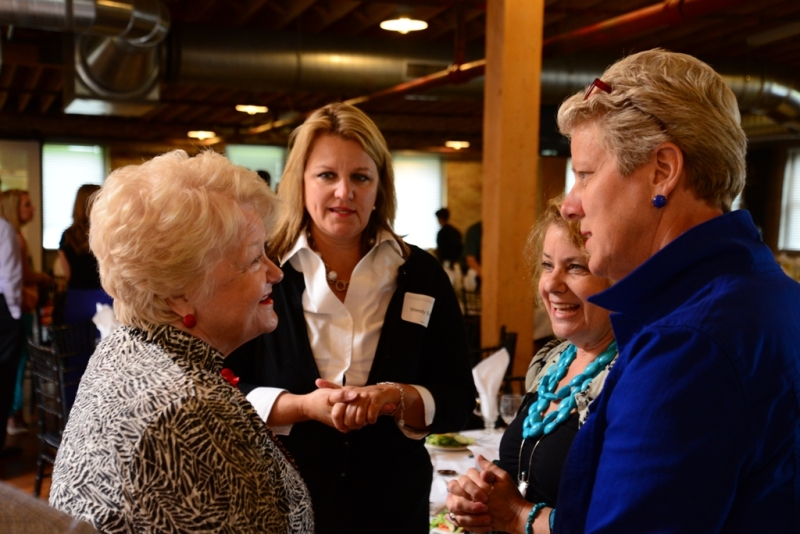 Judge Sara Smolenski, right, talks with guests at the Many Hands Against Hunger fundraising luncheon. Photo Credit: Raymond D. Kopen.