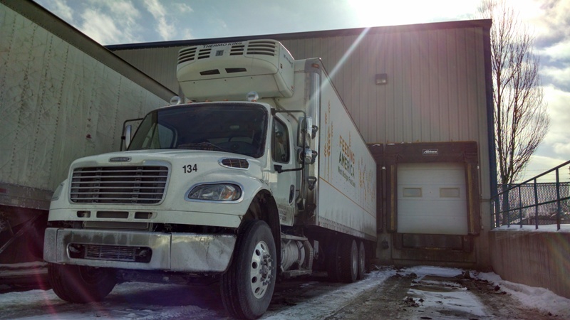 A Food Bank truck delivers food at Feeding America West Michigan's Comstock Park headquarters.