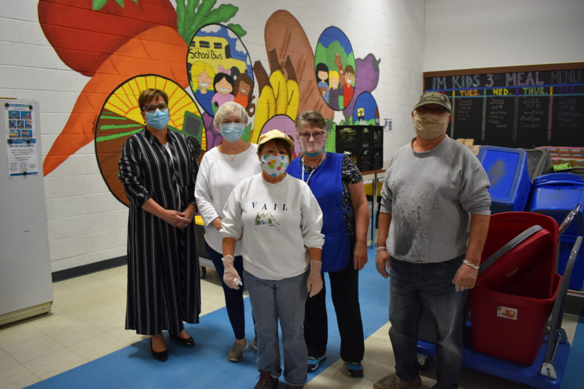 Volunteers of all ages pack dinners for kids in Montcalm and Ionia Counties