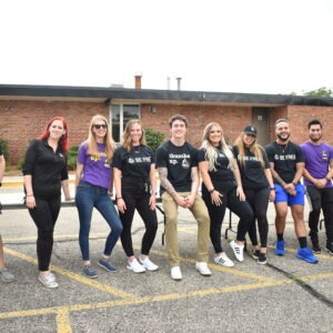 Planet Fitness volunteers pose for the camera at a Mobile Pantry