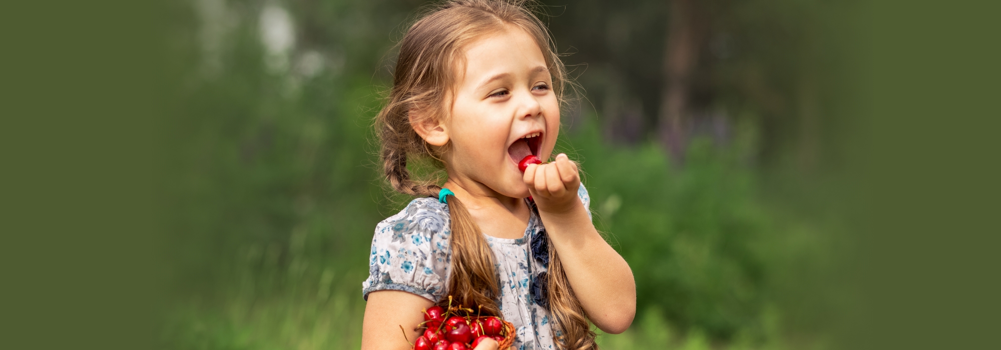Little girl eating fruit