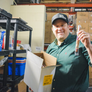 man holds jerky sticks