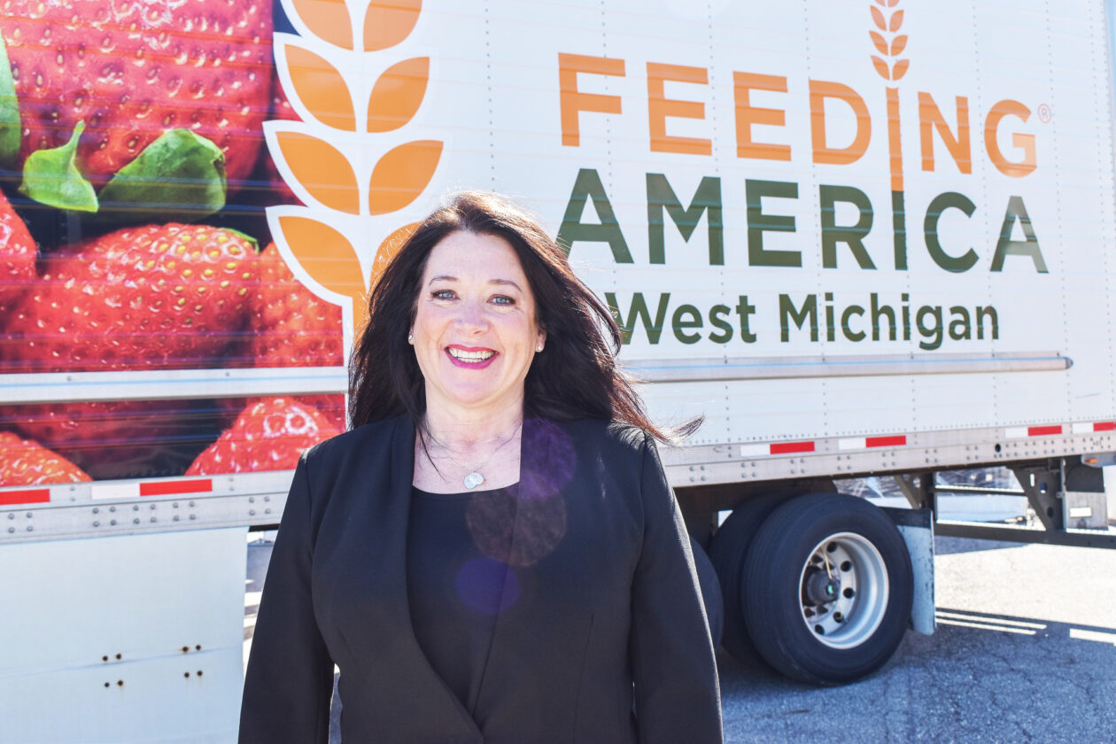 tracy in front of Feeding America West Michigan truc