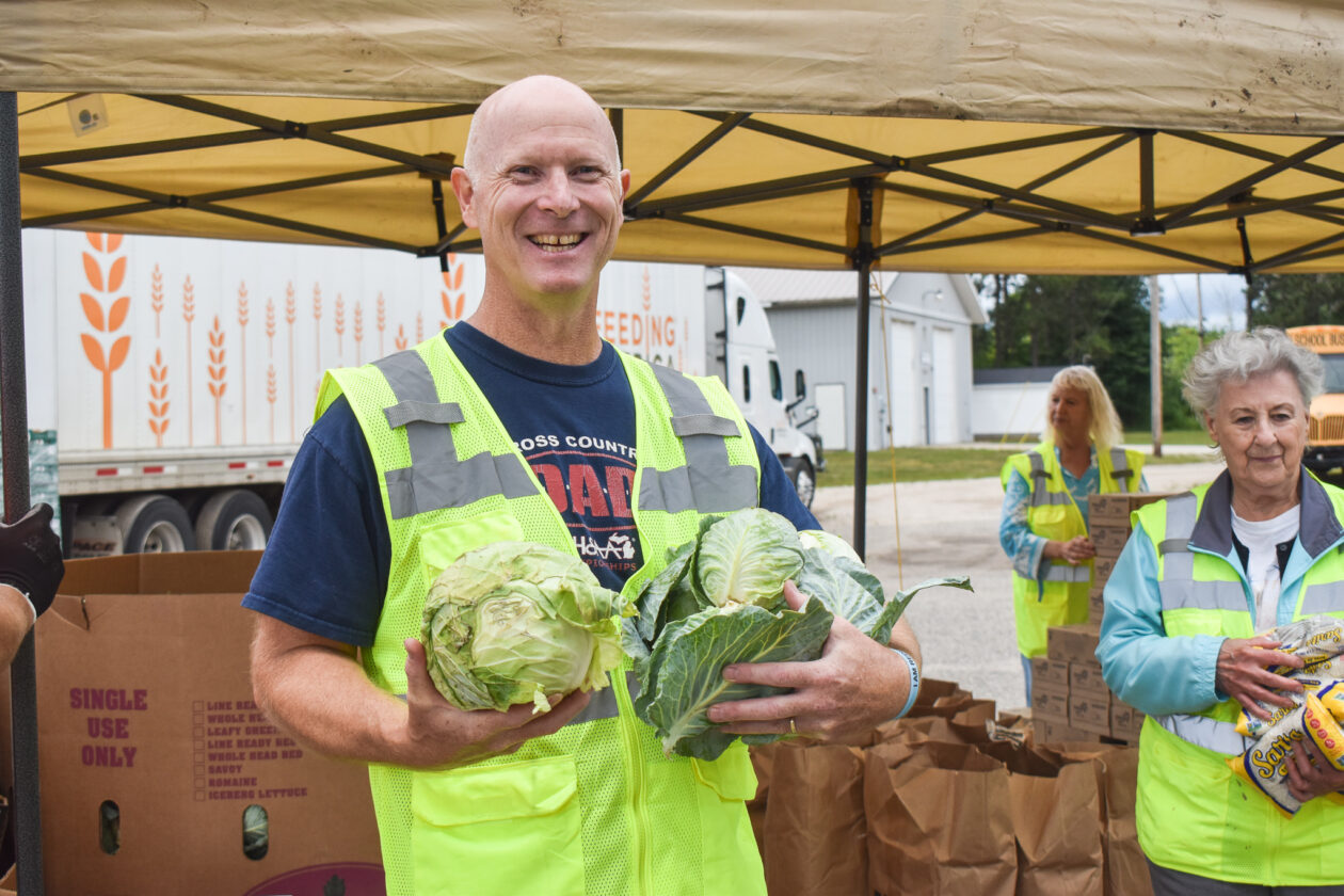 volunteer holding cabbage