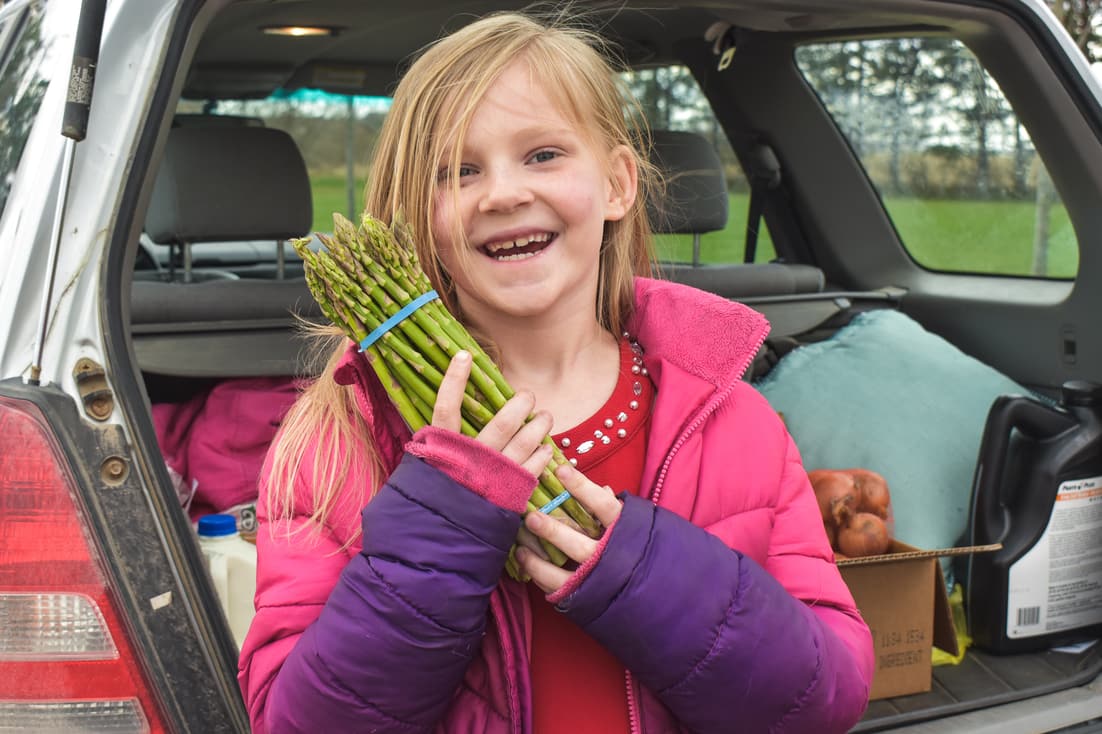 Girl holding asparagus