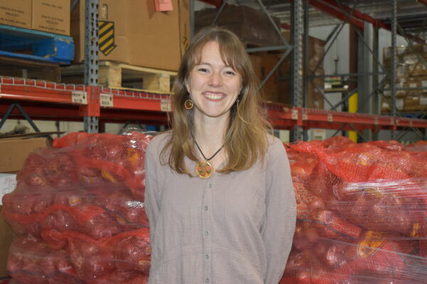 Abby LaLonde smiles at the camera while at our warehouse