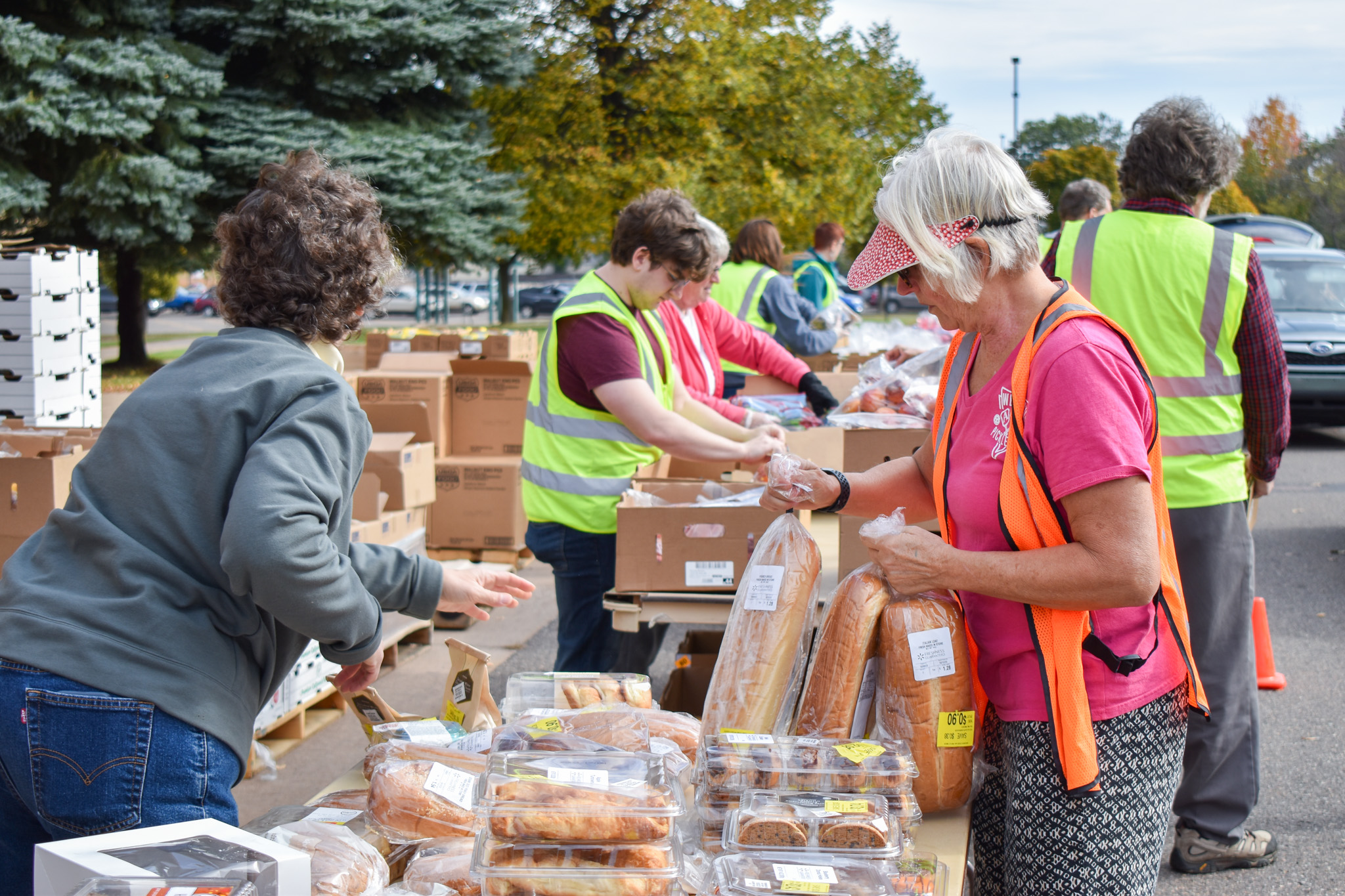 Several volunteers with food at a mobile food pantry in Marquette County.