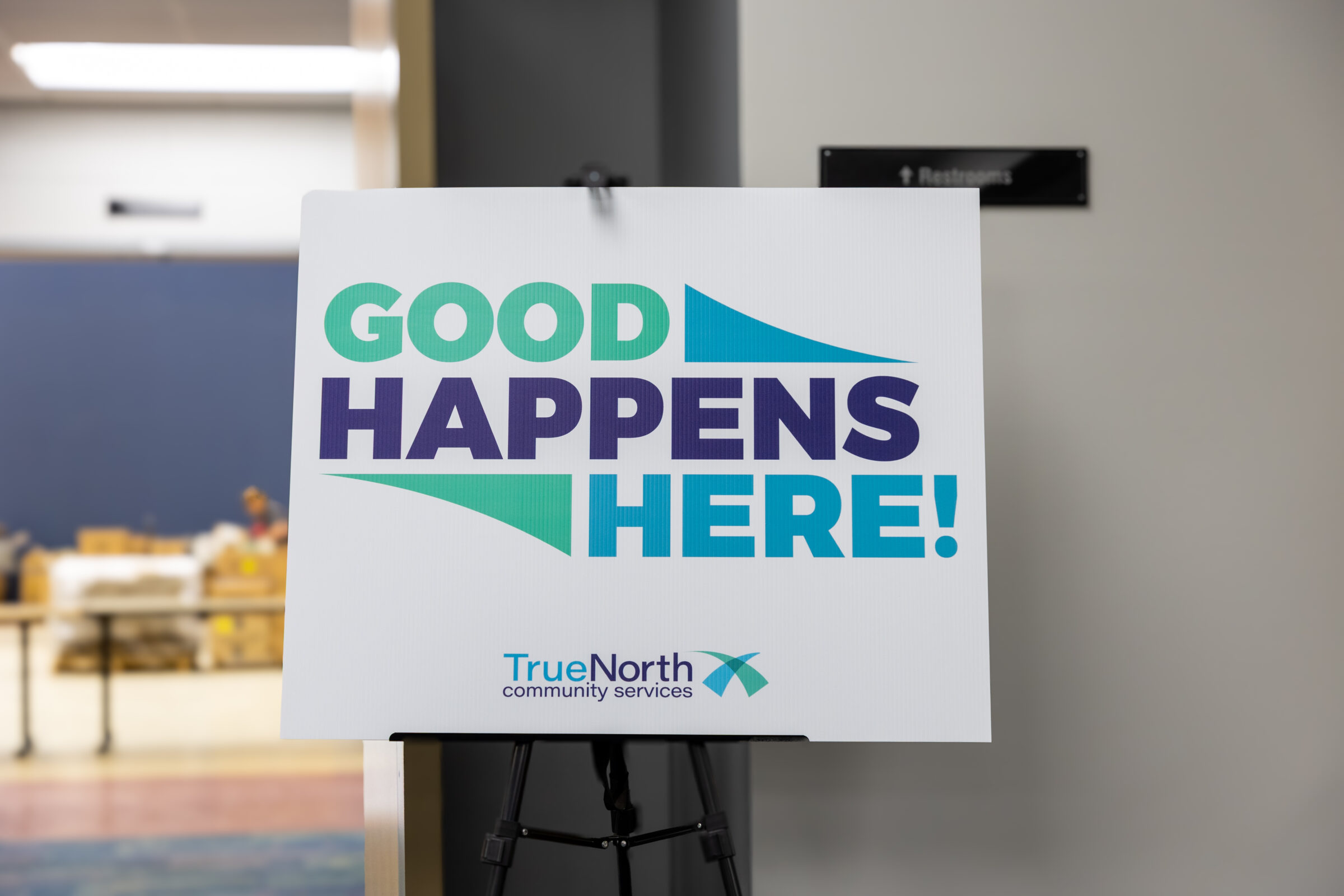 Sign at TrueNorth Community Services that says "Good Happens Here!"