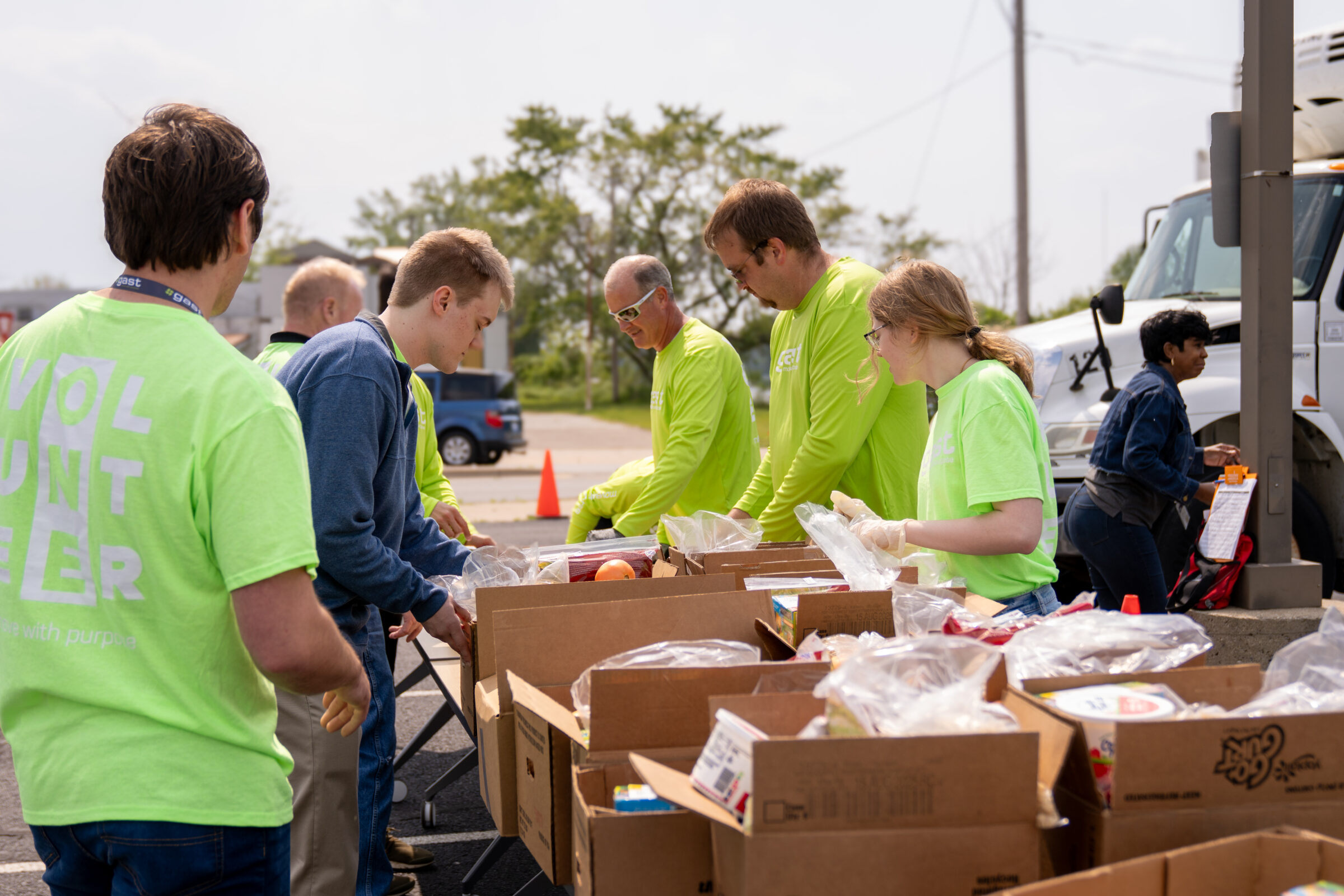 Volunteers from Gast Manufacturing assisting at a Benton Harbor mobile food
pantry.