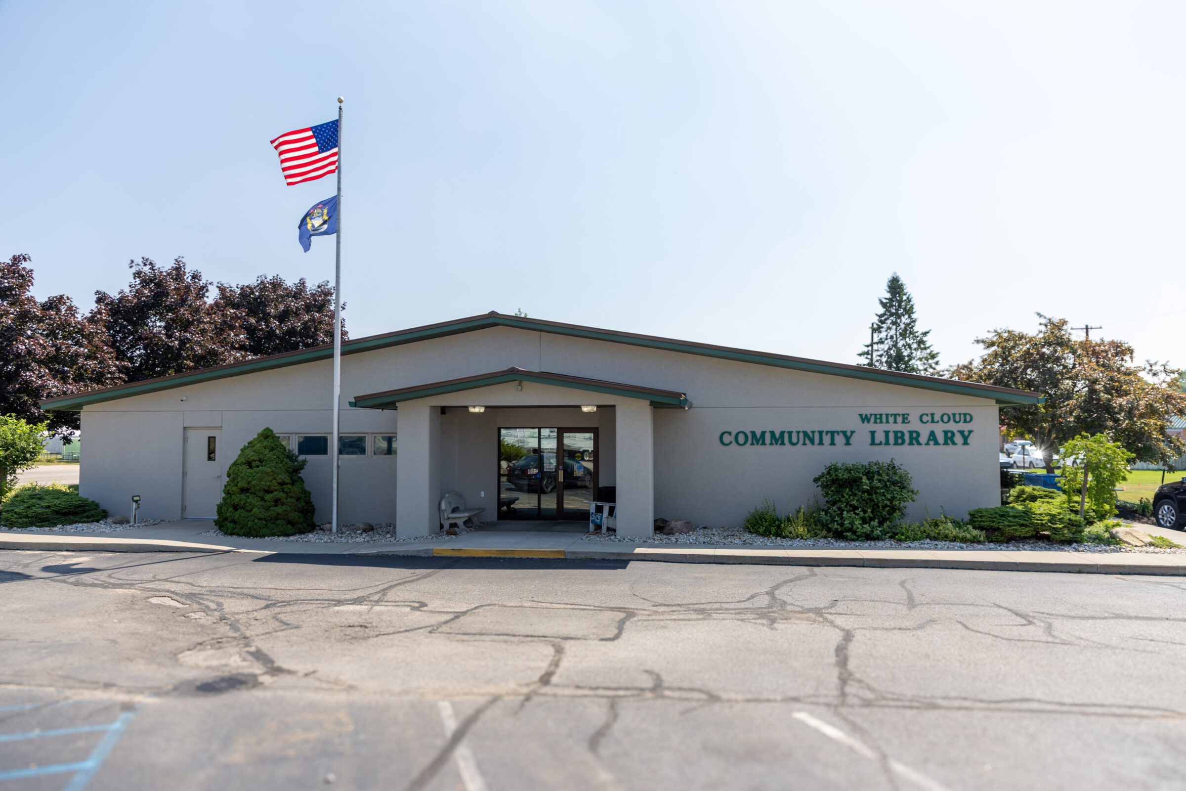 White Cloud Community Library exterior and parking lot. 