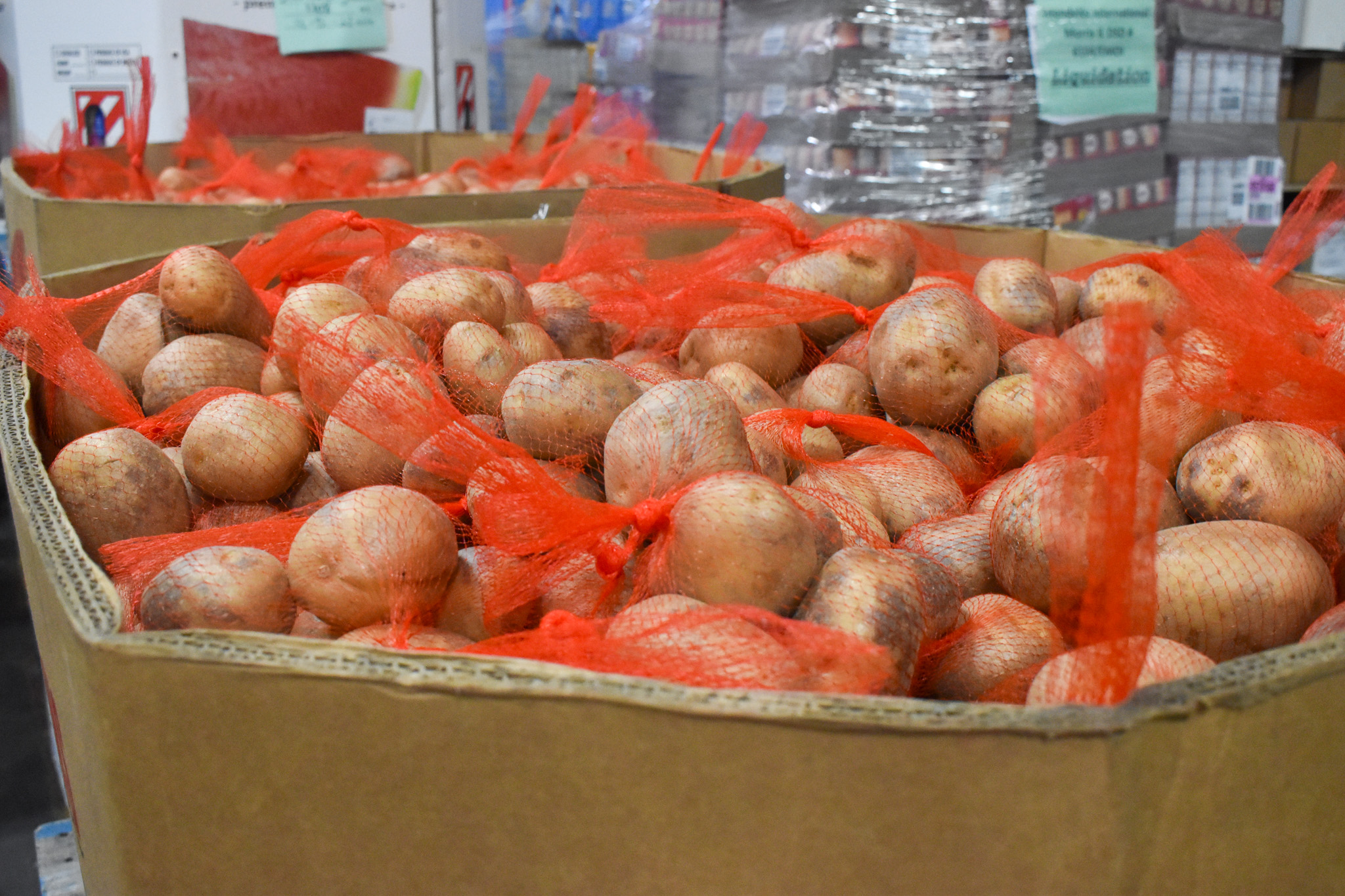 Large cardboard box of potatoes. 